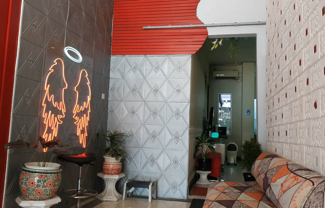 Modern aesthetic clinic interior with clean white walls, comfortable chairs, and medical equipment